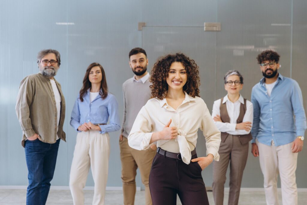 Team providing digital marketing services in Faridabad standing in modern office